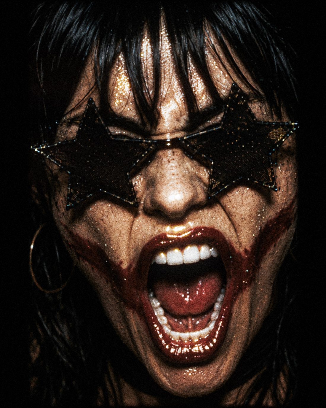 Extreme close-up of ForF's singer screaming, mouth wide open, teeth bared.