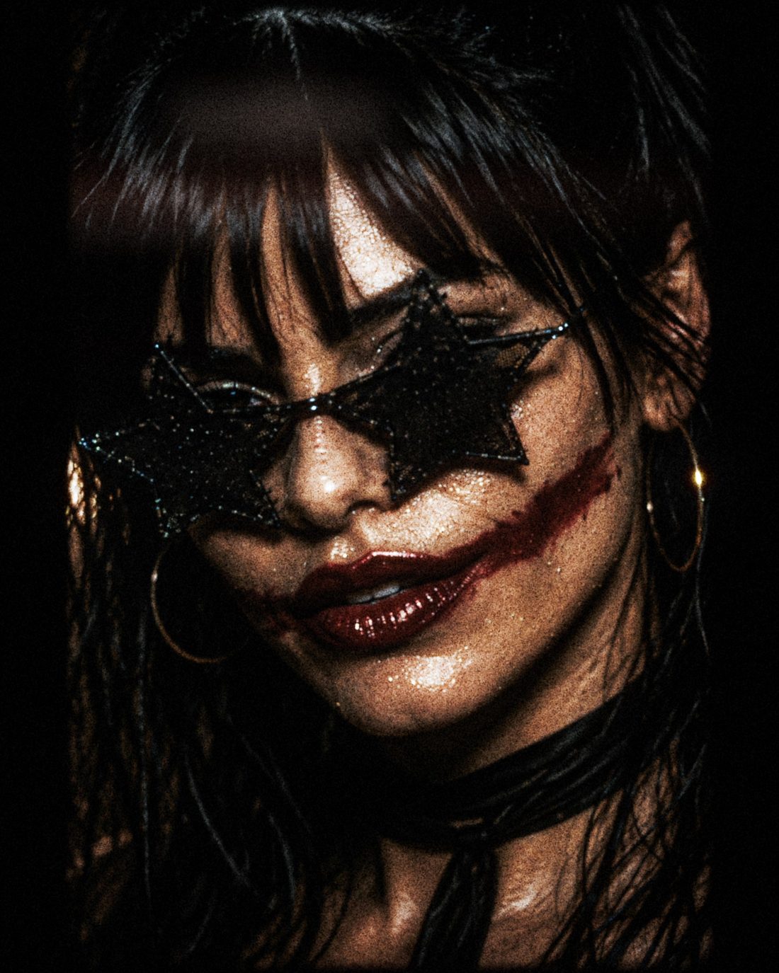 Close-up of ForF's singer, straight-faced behind black star-shaped glasses, soaked hair across her forehead.